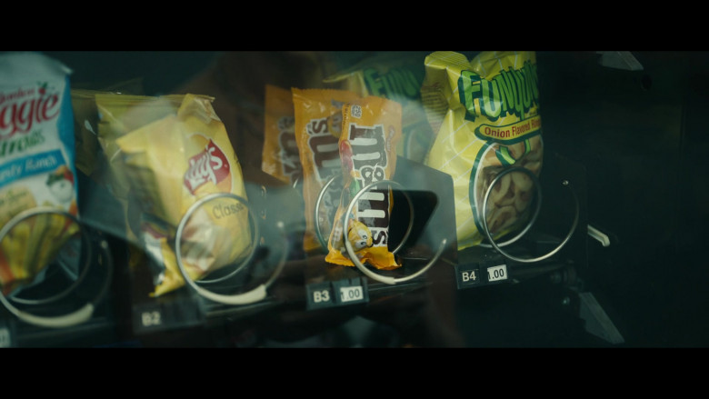Sensible Portions Garden Veggie Straws, Lay's Classic Potato Chips, M&M's Candies and Funyuns Onion Flavored Rings in Yellowjackets S01E09 Doomcoming (2022)