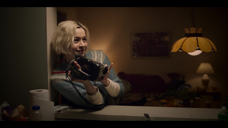 Sony Video Camera Held by Julia Chan as Anabelle and Junior Mints Candies in Archive 81 S01E02 Wellspring (2022)