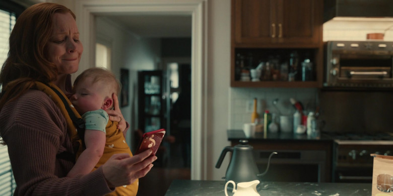 Apple iPhone Smartphone (Red) Held by Actress Lauren Ambrose as Dorothy Turner in Servant S03E08 Donut (2022)