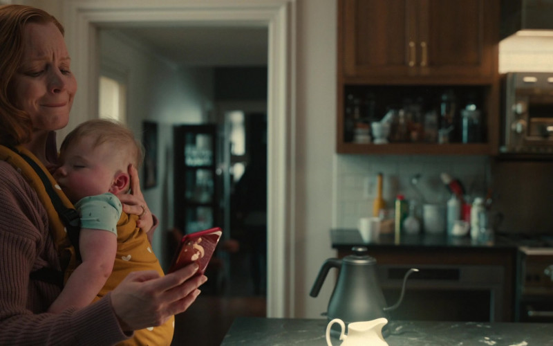 Apple iPhone Smartphone (Red) Held by Actress Lauren Ambrose as Dorothy Turner in Servant S03E08 Donut (2022)