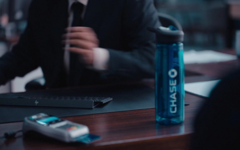 HP PC Keyboard and Chase Bank Bottle in WeCrashed S01E05 Hustle Harder (2022)