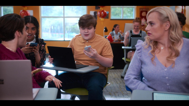 Microsoft Surface Laptop and Apple iPhone Smartphone of Jeremy Ray Taylor as Neil Chudd in Senior Year (2022)