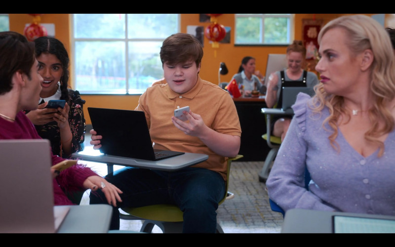 Microsoft Surface Laptop and Apple iPhone Smartphone of Jeremy Ray Taylor as Neil Chudd in Senior Year (2022)