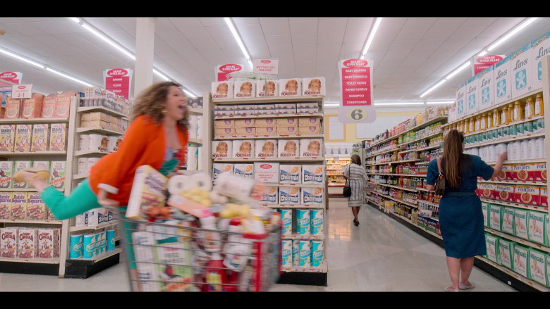 General Mills Honey Nut Cheerios Cereal, Kellogg's Banana Frosted Flakes, Frosted Mini-Wheats, Raisin Squares, Count Chocula, Quilted Northern Toilet Paper, Charmin, Smart Kitchen Paper Towels, Luvs Diapers, Pampers, Huggies in Gordita Chronicles S01E08 In America You Get What You Pay For (2022)