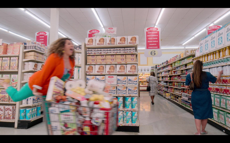 General Mills Honey Nut Cheerios Cereal, Kellogg's Banana Frosted Flakes, Frosted Mini-Wheats, Raisin Squares, Count Chocula, Quilted Northern Toilet Paper, Charmin, Smart Kitchen Paper Towels, Luvs Diapers, Pampers, Huggies in Gordita Chronicles S01E08 In America You Get What You Pay For (2022)