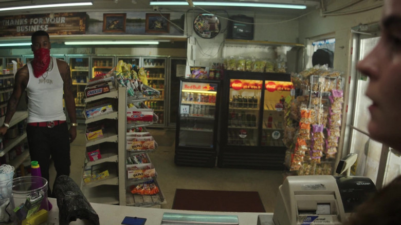 Snickers, Hostess Ho Hos, Starburst Candies, Little Debbie Donuts and Honey Buns, Red Bull Energy Drink Refrigerator, Coca-Cola Soda Refrigerator in P-Valley S02E03 The Dirty Dozen (2022)