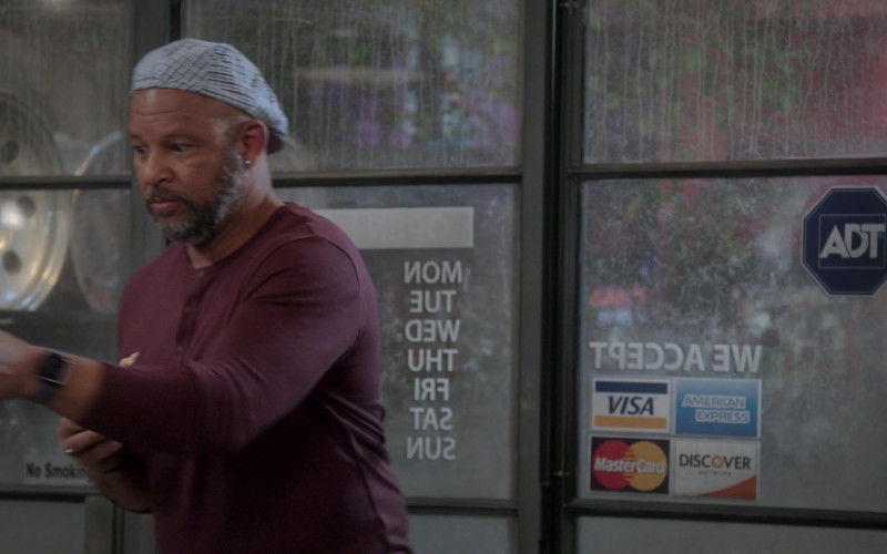 VISA, Mastercard, American Express, Discover Network and ADT Security Stickers in The Upshaws S02E06 "New Growth" (2022)