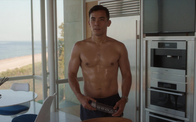 Voss Water Bottle Held by Conrad Ricamora as Will in Fire Island (2022)