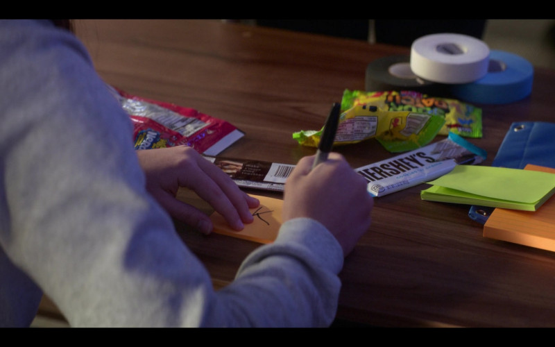 Hershey’s Cookies ‘n’ Creme Candy Bars, SOUR PATCH KIDS Original Soft & Chewy Candy, Nerds Candy in The Mighty Ducks Game Changers S02E03 Coach Classic (2022)