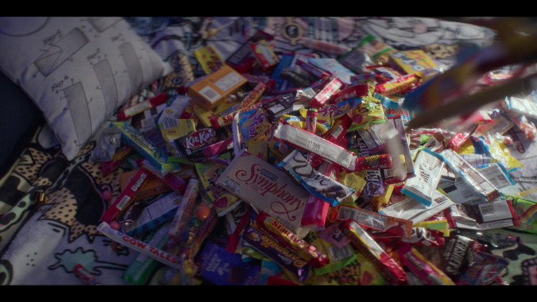 Hershey's Symphony Milk Chocolate Bar, Cow Tales Candy, Kit Kat, Starburst, Swedish Fish, Cadbury Chocolate, Sour Punch Candy, Tootsie Roll Dots Candy, Sour Patch Kids, Juicy Drop Pop, DOVE Chocolates in The Mighty Ducks Game Changers S02E03 Coach Classic (2022)