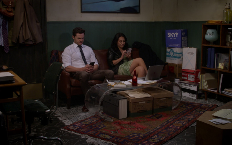 Apple MacBook Laptop, Bankers Boxes, Skyy Vodka, Siete Kettle Cooked Potato Chips, Miller High Life, ROXX Vodka, Mossburn Speyside Scotch Whisky and Crown Royal Blended Canadian Whisky in How I Met Your Father S02E01 Cool and Chill (2023)