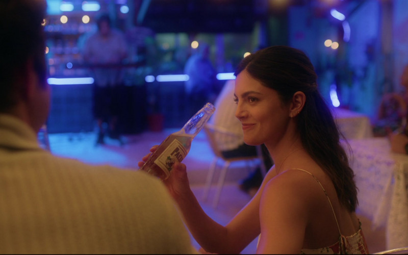 Pacifico Beer of Monica Barbaro as Sophie Wilder in At Midnight 2023 Movie (2)