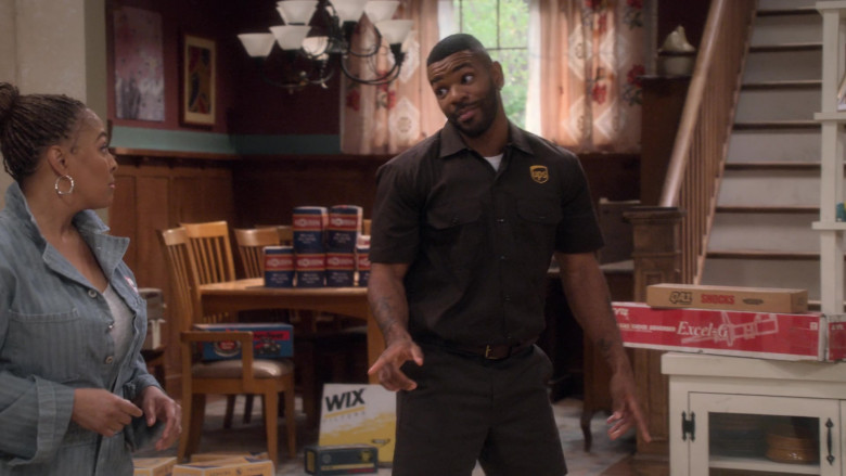 UPS Uniform Worn by Jermelle Simon as Bernard Upshaw Jr. and WIX Filters in The Upshaws S03E02 Home Repairs (2023)