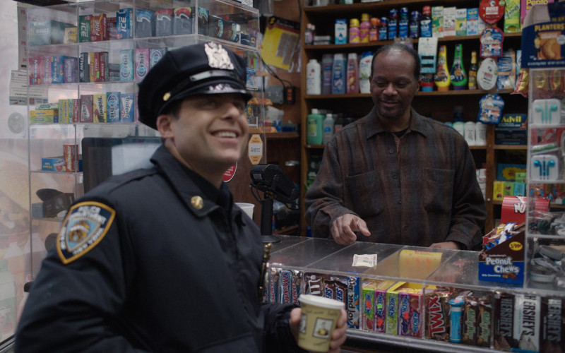 Mike And Ike, Halls, Dentyne, Orbit, Wrigley's, Trident, Advil, Planters, 3 Musketeers, M&M's, Snickers, Almond Joy, Hi-Chew, Twix, Milky Way, Hershey's, Kit Kat in East New York S01E18 "In the Bag" (2023)