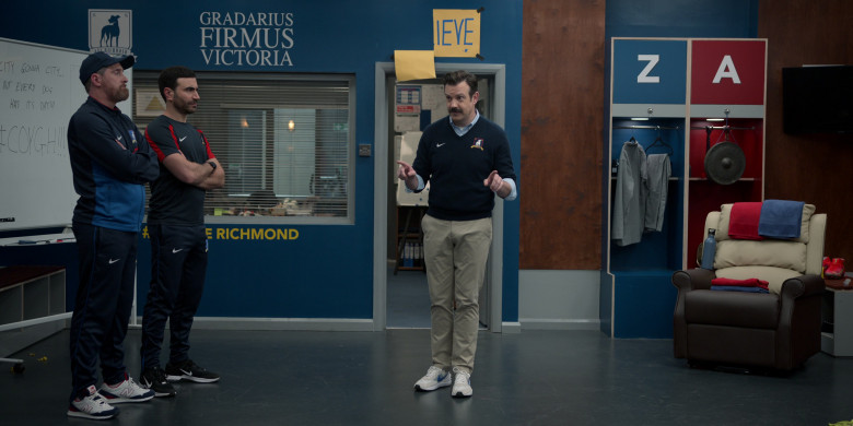 Nike Air Zoom Sneakers of Jason Sudeikis, New Balance Shoes of Brendan Hunt as Coach Beard, Nike Black Sneakers and Clothes of Brett Goldstein as Roy Kent in Ted Lasso S03E05 Signs (1)