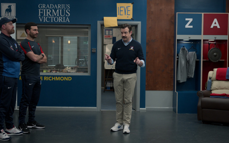 Nike Air Zoom Sneakers of Jason Sudeikis, New Balance Shoes of Brendan Hunt as Coach Beard, Nike Black Sneakers and Clothes of Brett Goldstein as Roy Kent in Ted Lasso S03E05 Signs (1)