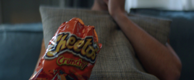 Cheetos crunchy corn puff snack in Beautiful Disaster (2023) - 366997