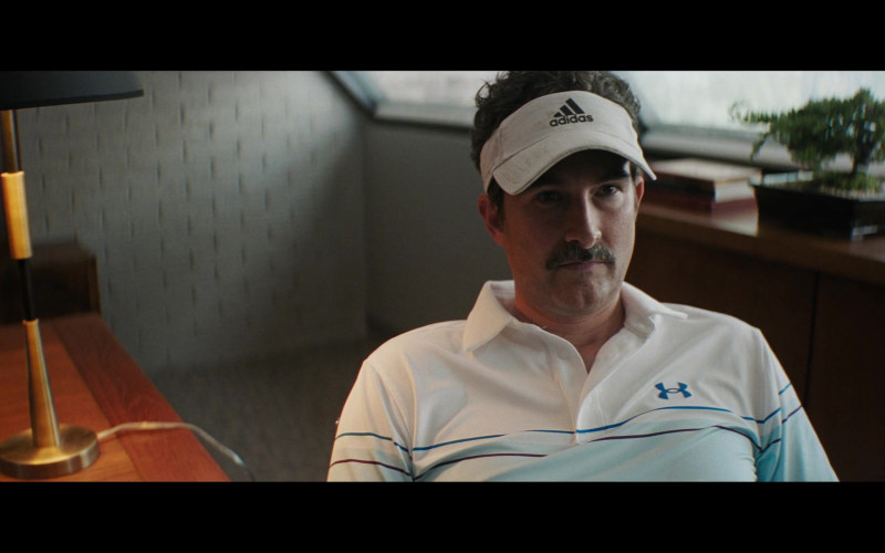 Adidas Visor Cap and Under Armour Shirt in Pain Hustlers (2023)