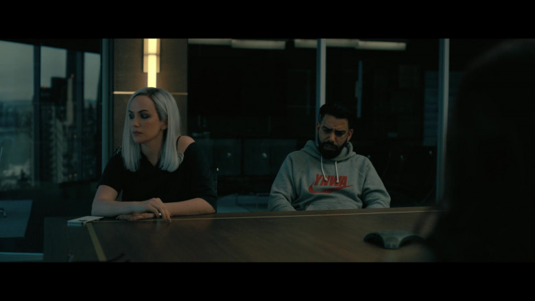 Apple iPhone White Smartphone of Kate Siegel as Camille L’Espanaye  and Nike Heritage Liverpool YNWA Raglan Pullover Hoodie Worn by Rahul Kohli as Napoleon "Leo" Usher in The Fall of the House of Usher S01E03 "Murder in the Rue Morgue" (2023) - 413215