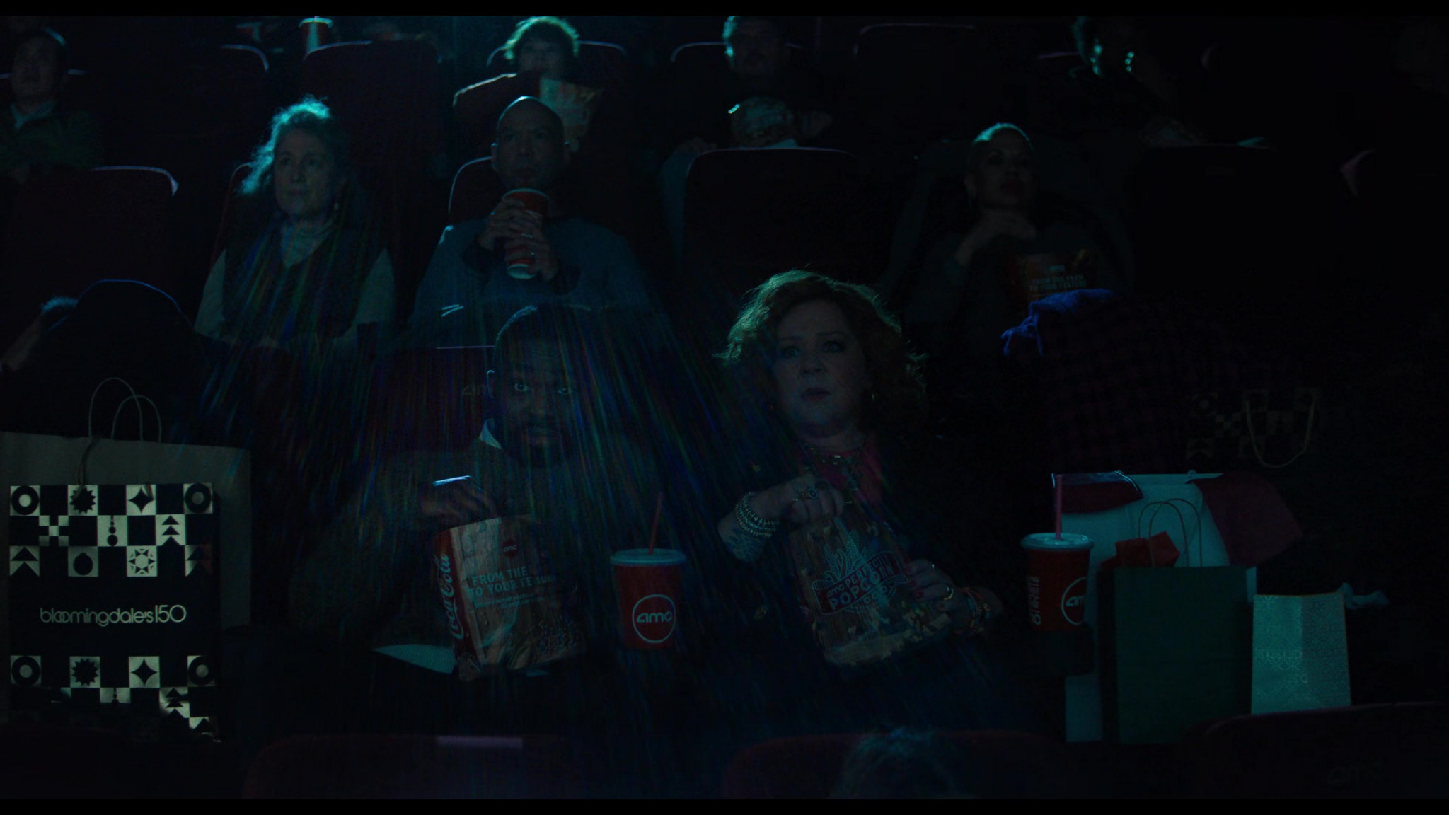 AMC Movie Theater, CocaCola And Bloomingdale's Bag In Genie (2023)