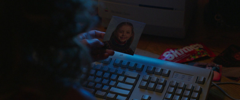 Apple Computer and Skittles Candies in Ordinary Angels (2024) - 488388