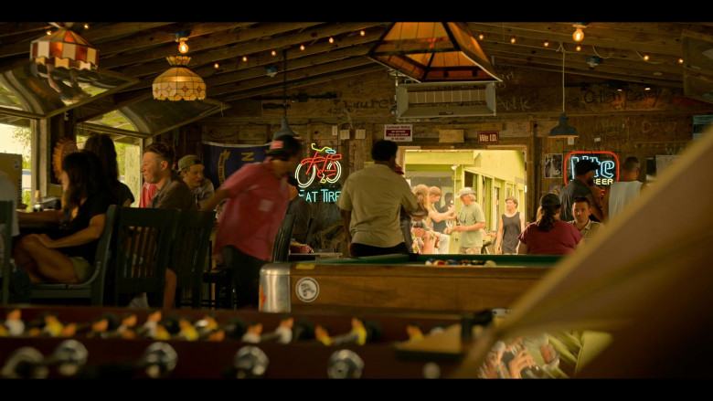 New Belgium Fat Tire Beer Sign and Miller Lite Signs in Outer Banks S04E02 "Blackbeard" (2024) - 586806