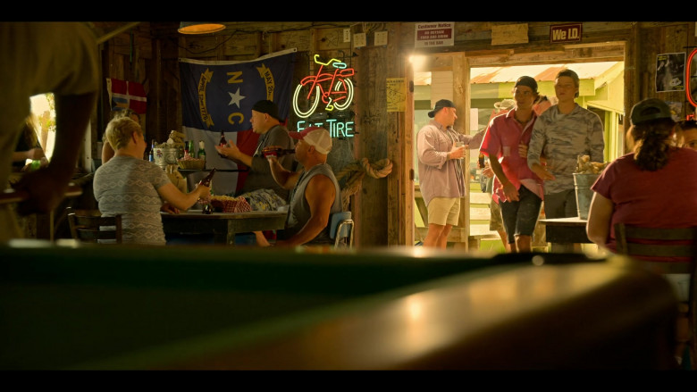 New Belgium Fat Tire Beer Sign and Budweiser Bottles in Outer Banks S04E02 "Blackbeard" (2024) - 586795